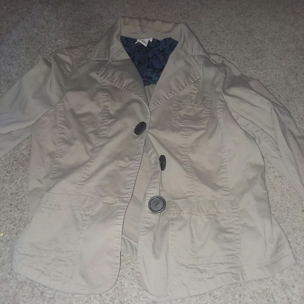 Woman's tan long sleeve casual jacket.